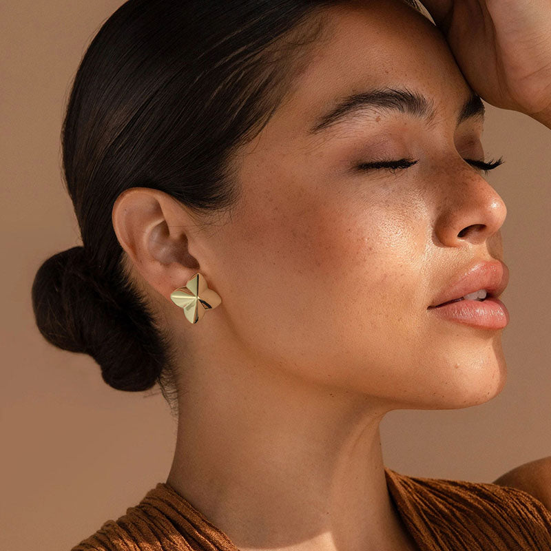 Golden, four-leaf clover shaped earrings